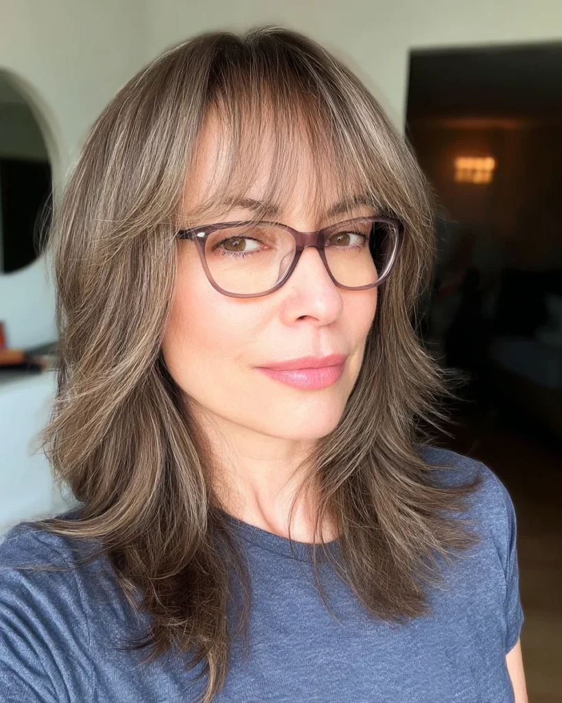Best Hairstyles for Women Over 40 With Glasses That Are Anything but Boring Shaggy Ash Brown Layers with Curtain Bangs