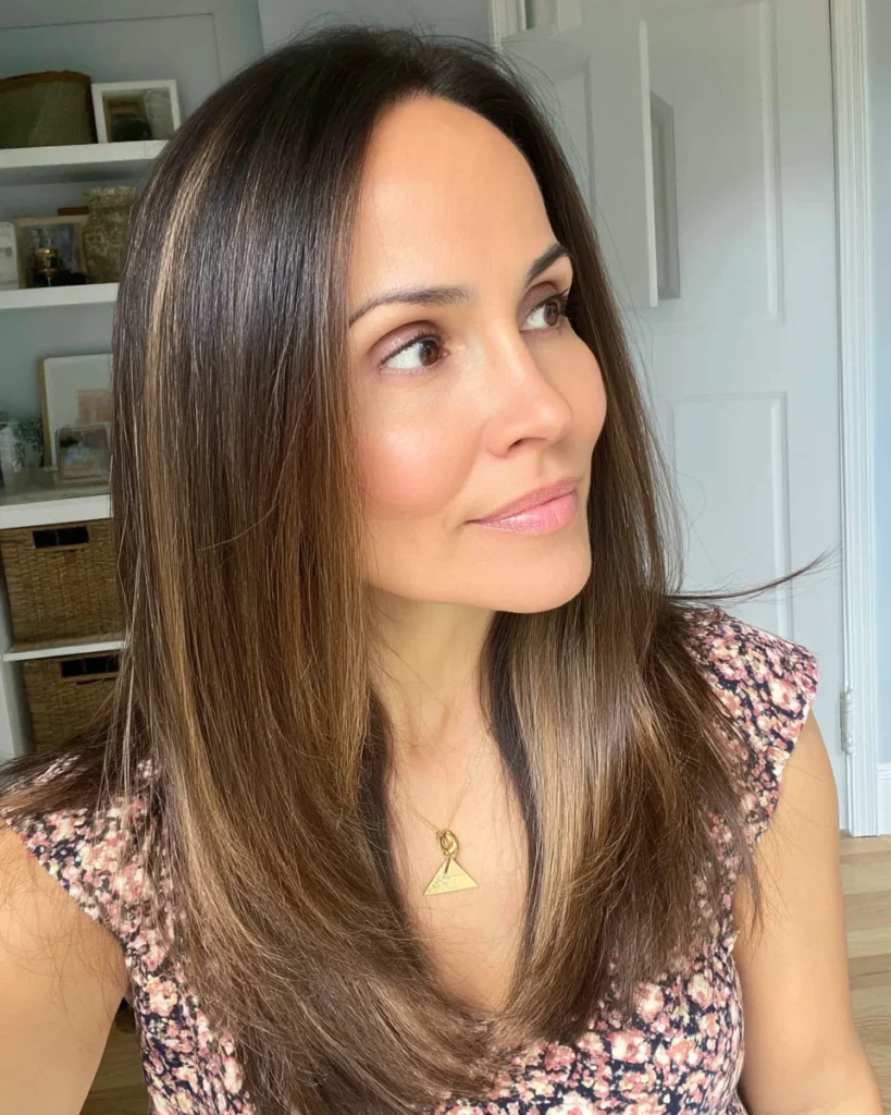 15 Stunning Brunette Hairstyles for Women Over 40 to Try This Season Sleek Brunette with Face-Framing Layers – A Timeless Choice for Women Over 40