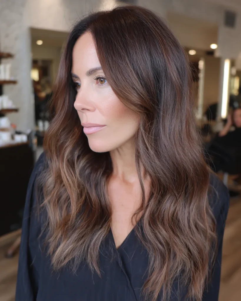 15 Stunning Brunette Hairstyles for Women Over 40 to Try This Season Brunette Hairstyles for Women Over 40:Wavy Brunette with Subtle Balayage