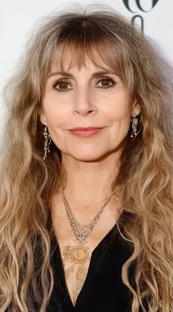 15 Best Hairstyles with Bangs for Women Over 40 with Long Hair (Look Instantly Younger) Natural Waves with Wispy Bangs